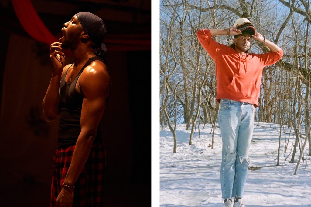 J Bouey is photographed from the side, holding their bottom lip open. They are wearing a navy colored bandana on their head, a navy tank top, and red checkered pajama pants. Jordan Lloyd wears an orange hoodie and light wash denim jeans. He stands tall in a field of snowwith several baseball caps on his head.