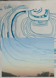 Photo of a soft orange and blue sky layered over a drawing of many rings and circles in blue pen. The word "valley" written in the top left corner.